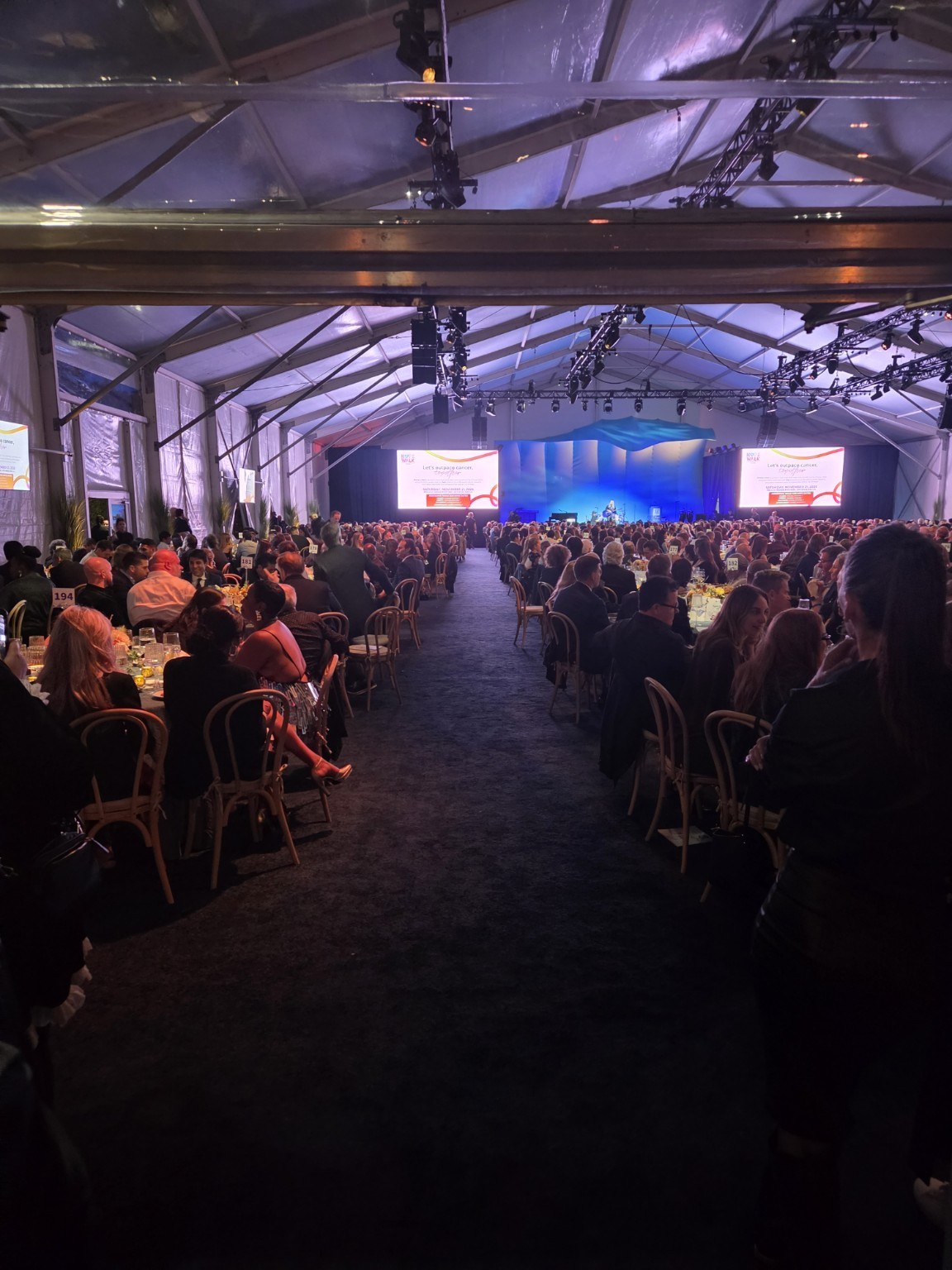 Guests gathered at a large banquet event venue